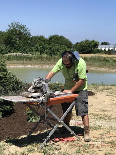 Man cutting stone