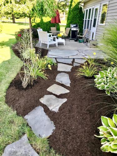 Garden and patio with stone pathway
