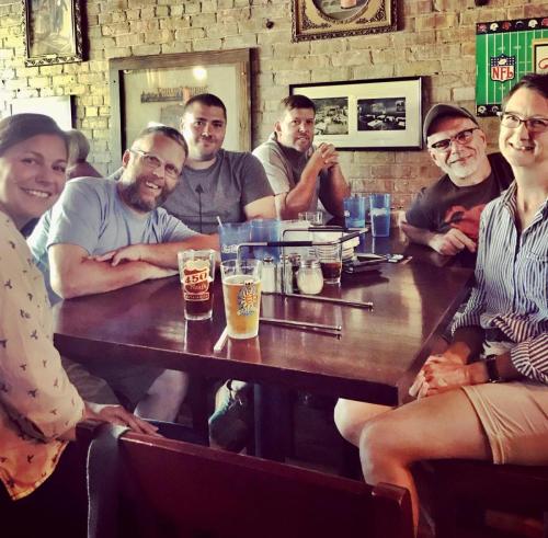 Group of friends around table in restaurant