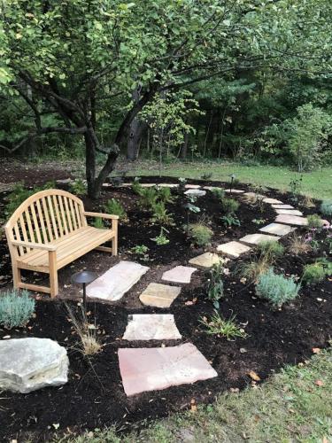 Garden with bench and stone pathway
